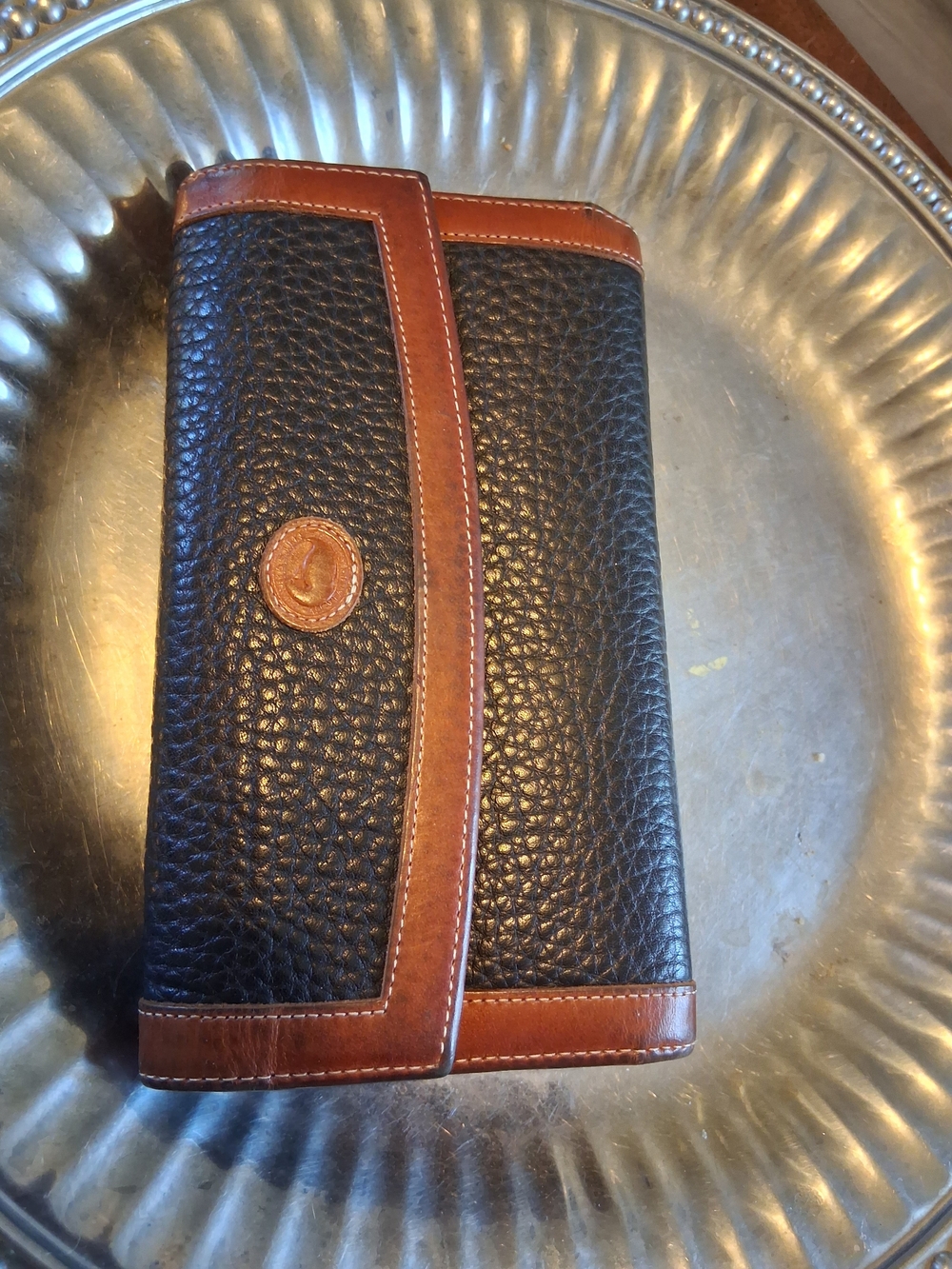 Dooney & Bourke Black Pebbled Leather Wallet with Brown Trim